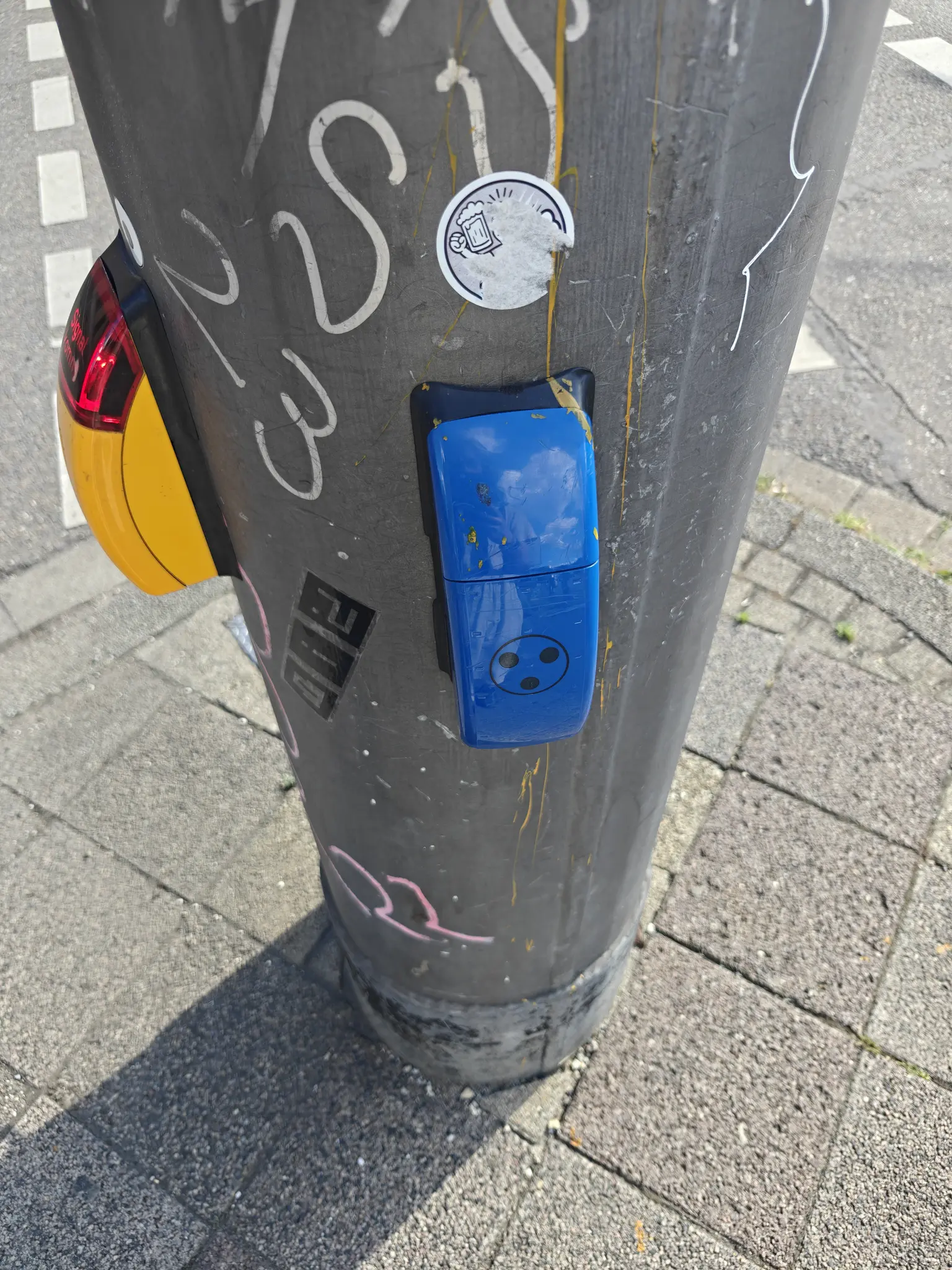 a blue pedestrian crossing button thing
